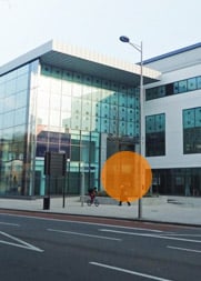A photograph of the Bristol office building. It is opposite Hargreaves Lansdown, and the main door is highlighted.