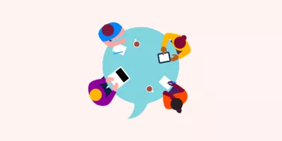 Illustration of four people sat around a table with a laptop, a tablet and paper and pens in front of them.