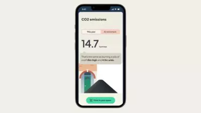 A mocked up image of iphone saying 'CO2 emissions: This year: 14.7 tonnes. That's the same as burning a pile of coal 1.6m high and 4.3m wide' With the option to 'view in your space'