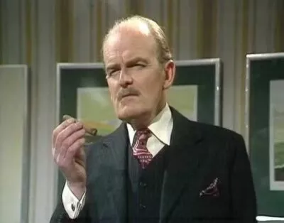 An old image from a TV show of a man smoking a cigar