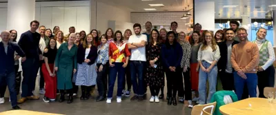 The whole cxpartners team stood together at a company conference
