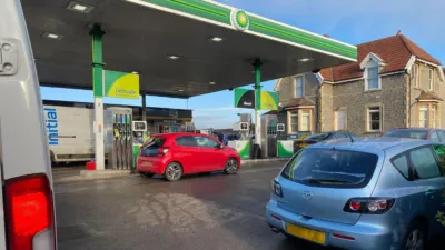 Traffic backing up as a customer was using the fuel payment app in their car.